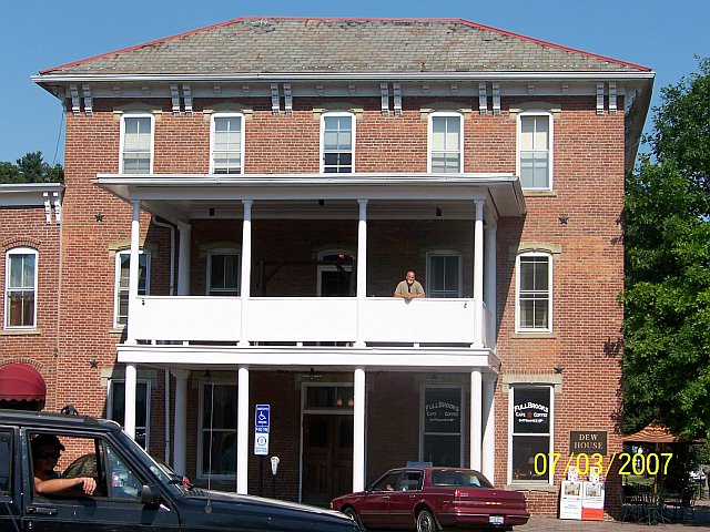 Dew Hotel in Nelsonville, Ohio. Picture taken in July 2007. Brian Austin Dew is standing on the seco
